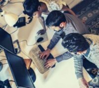 Image of people working at a computer